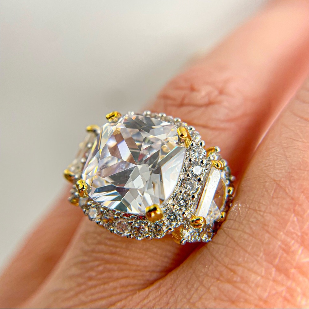 Cushion cut cubic zirconia gold toned ring with round and half circle accents